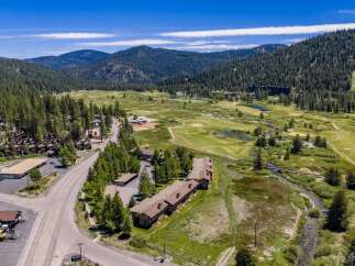 Discover this stunning property nestled amidst a picturesque mountain landscape, offering a unique blend of natural beauty and recreational opportunities.