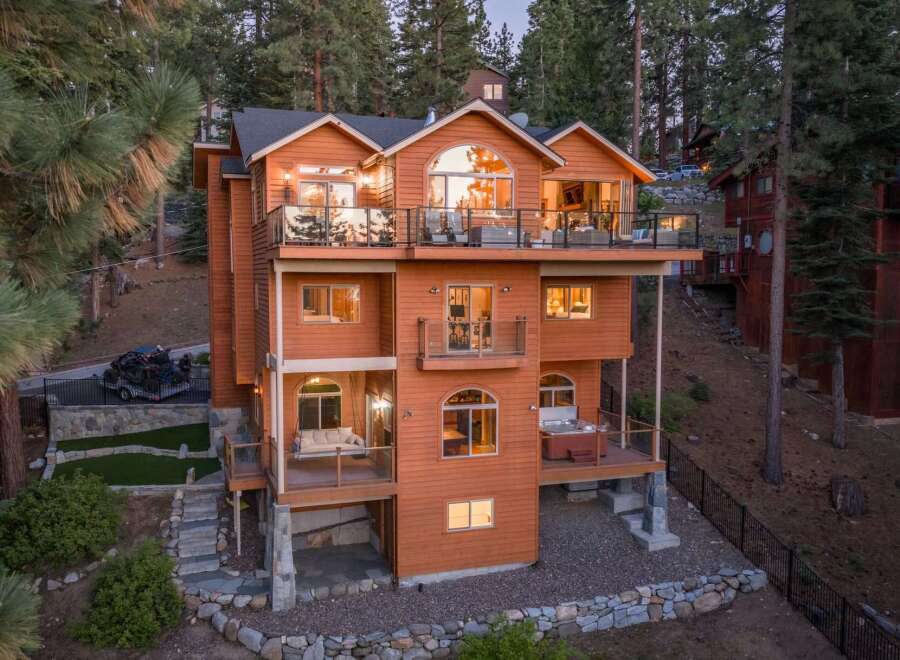 Experience luxury mountain living in this stunning multi-level home, nestled amidst towering pine trees.