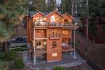 Experience luxury mountain living in this stunning multi-level home, nestled amidst towering pine trees.
