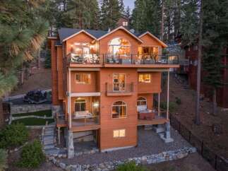 Experience luxury mountain living in this stunning multi-level home, nestled amidst towering pine trees.