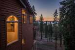 Experience breathtaking sunset views from this stunning property, nestled amidst a serene forest landscape.