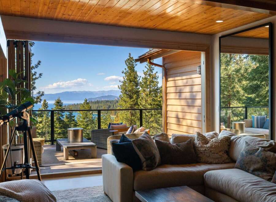 Experience breathtaking lake and mountain views from this stunning property, featuring an expansive deck perfect for entertaining or quiet relaxation.