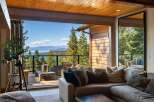 Experience breathtaking lake and mountain views from this stunning property, featuring an expansive deck perfect for entertaining or quiet relaxation.