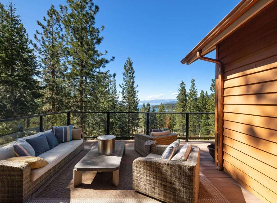 Experience breathtaking lake and mountain views from this stunning deck, perfect for entertaining or relaxing.