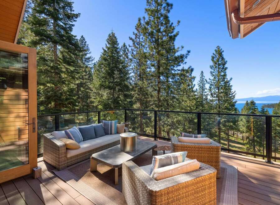 Experience breathtaking lake and mountain views from this stunning deck, perfect for outdoor entertaining.