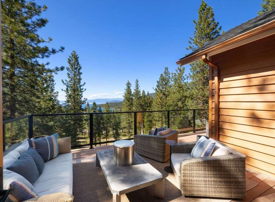 Experience breathtaking lake and mountain views from this stunning deck, perfect for entertaining or relaxing.