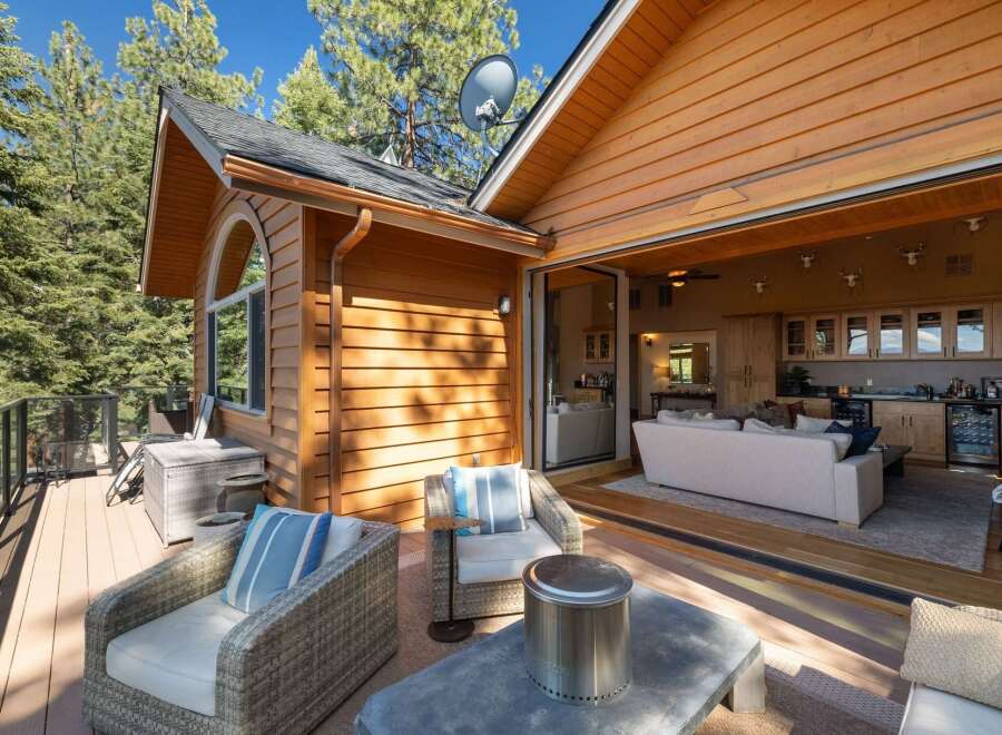 Experience seamless indoor-outdoor living with this stunning property, featuring a spacious deck perfect for entertaining and relaxing amidst a beautiful natural setting.
