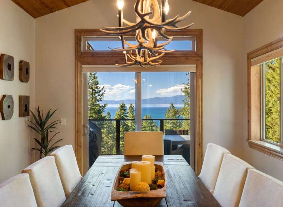 Experience breathtaking lake and mountain views from this stunning dining room, perfect for entertaining.