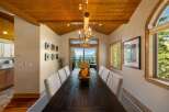 Experience breathtaking lake and mountain views from this stunning dining room, perfect for entertaining.