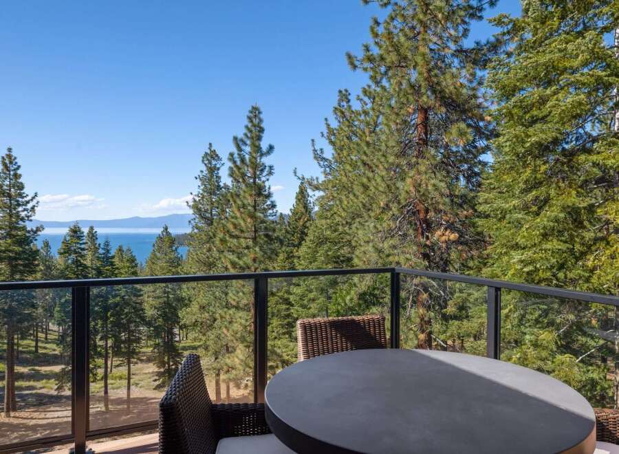 Enjoy breathtaking lake views from this stunning property, nestled amidst a serene pine forest.