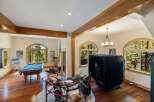 Experience ultimate entertainment in this spacious game room, featuring a professional pool table and a complete drum set for endless fun.