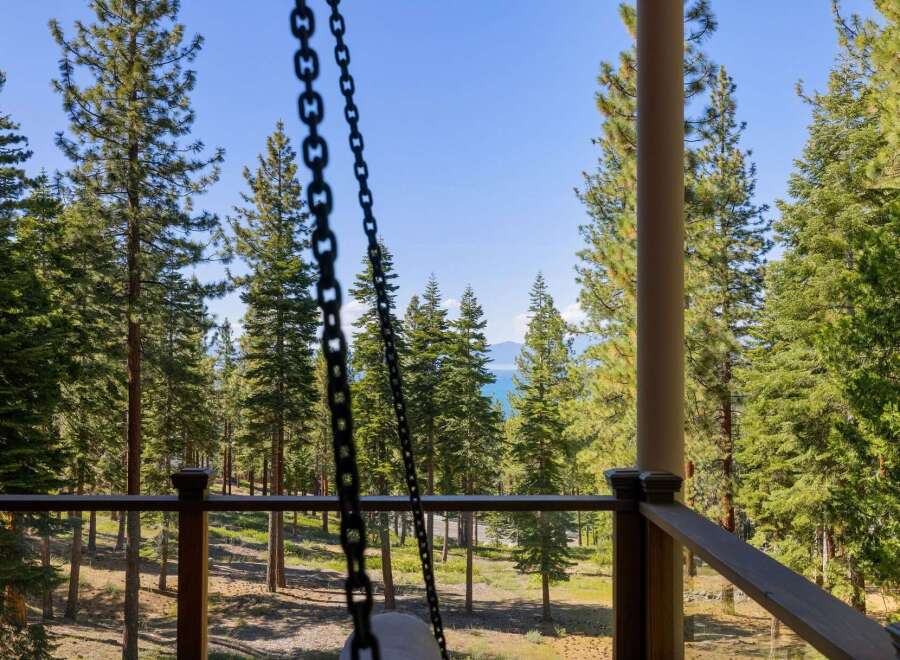 Experience breathtaking lake views from this stunning property, nestled amidst a serene pine forest.