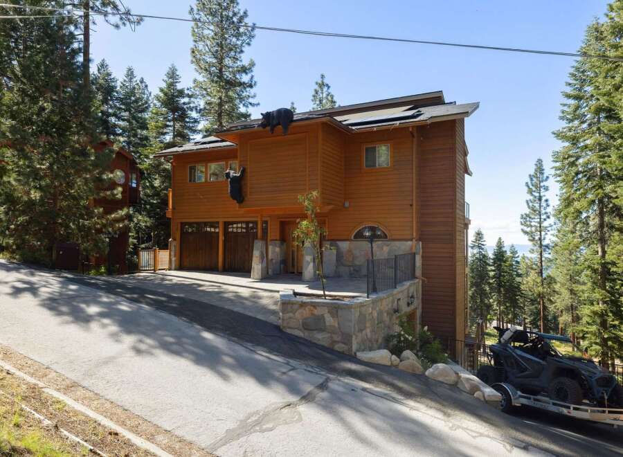 Experience the ultimate mountain retreat with this stunning wood-sided home, featuring unique bear-themed decor that adds a whimsical touch.