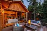 Experience seamless indoor-outdoor living with this stunning property, featuring a spacious deck with a fire pit perfect for entertaining.