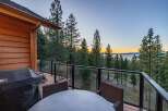 Enjoy breathtaking lake views from this stunning property's expansive deck, perfect for entertaining or quiet relaxation.