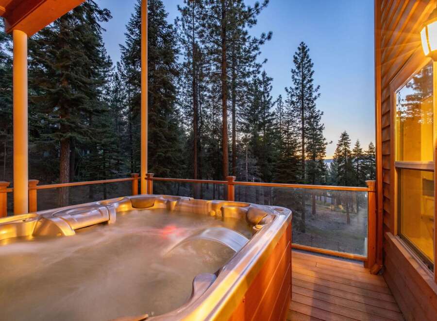 Indulge in ultimate relaxation with this luxurious hot tub, perfectly situated on a spacious wooden deck.