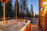 Indulge in ultimate relaxation with this luxurious hot tub, perfectly situated on a spacious wooden deck.