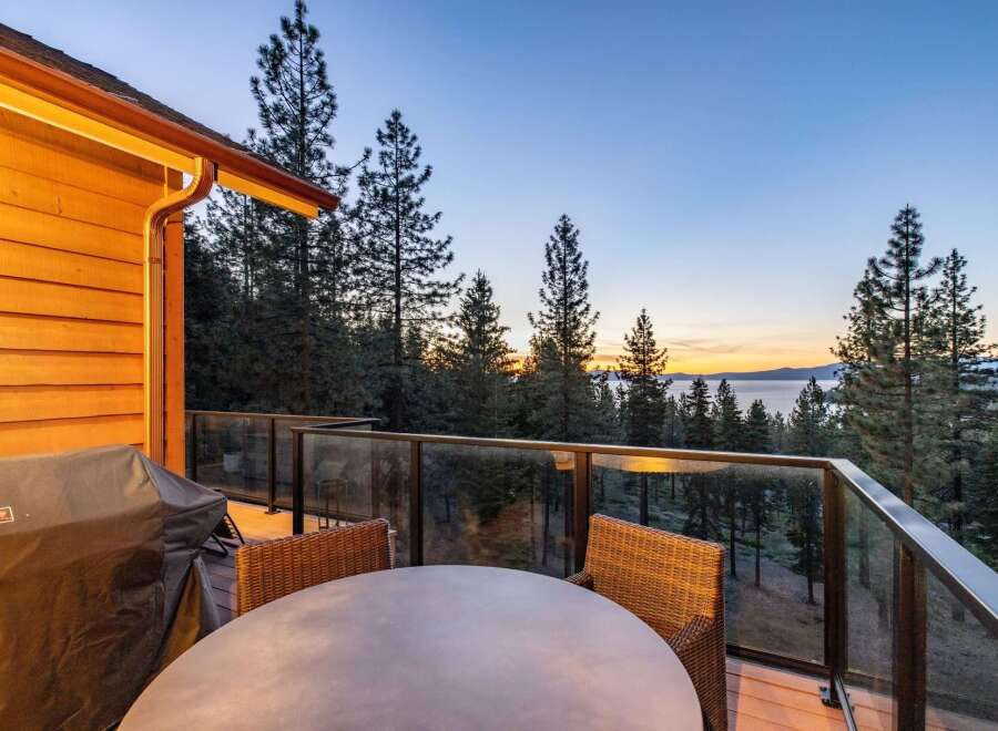 Enjoy breathtaking sunset views over the lake from this stunning deck, perfect for outdoor entertaining.