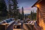 Experience breathtaking sunset views from this stunning mountain retreat's expansive deck.