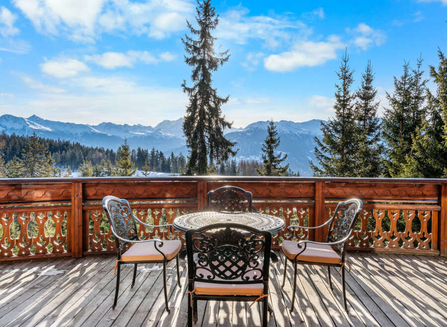 Experience breathtaking mountain views from this charming chalet's private balcony, perfect for enjoying your morning coffee or evening wine.