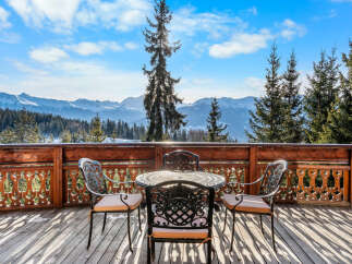 Experience breathtaking mountain views from this charming chalet's private balcony, perfect for enjoying your morning coffee or evening wine.