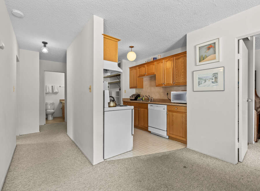 Discover this charming kitchen featuring ample oak cabinetry and a convenient dishwasher.