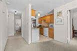 Discover this charming kitchen featuring ample oak cabinetry and a convenient dishwasher.