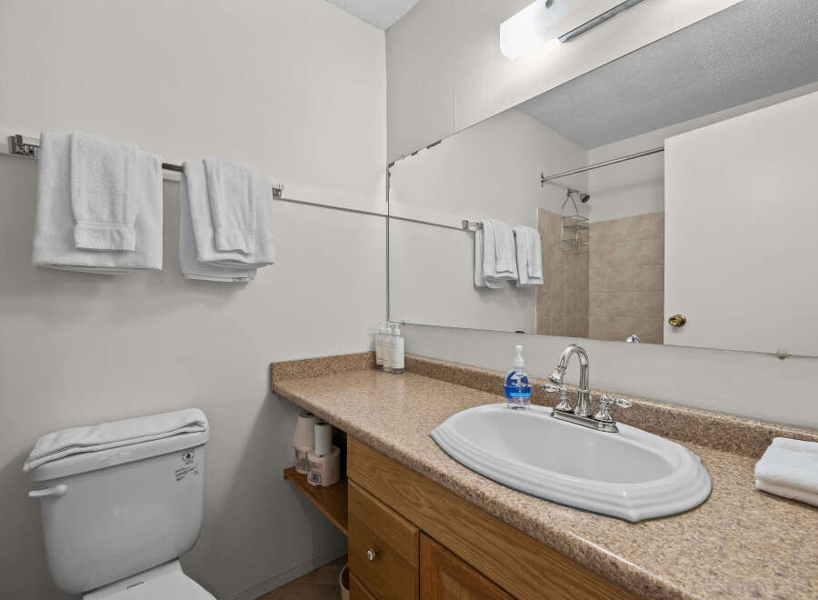 This bathroom features a clean and functional design, perfect for any home.