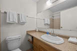 This bathroom features a clean and functional design, perfect for any home.