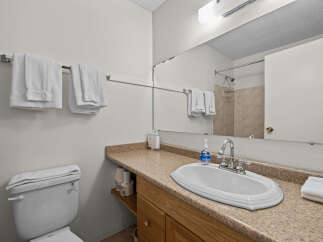 This bathroom features a clean and functional design, perfect for any home.
