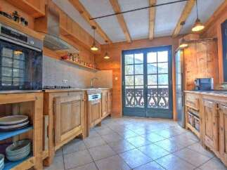 Experience rustic charm in this mountain-view kitchen, featuring warm wooden cabinetry and a spacious layout.