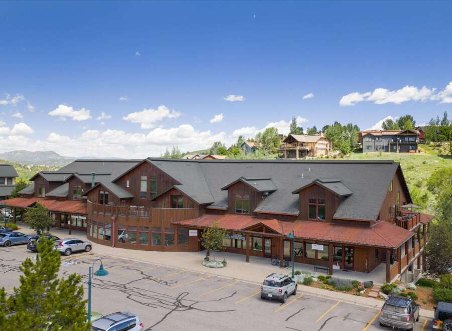 Discover this charming commercial building nestled in a picturesque mountain setting.