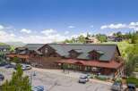 Discover this charming commercial building nestled in a picturesque mountain setting.