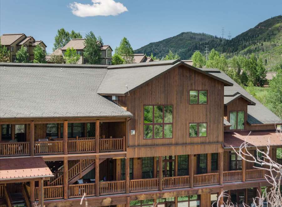Experience rustic charm and mountain living in this stunning wooden lodge-style home.