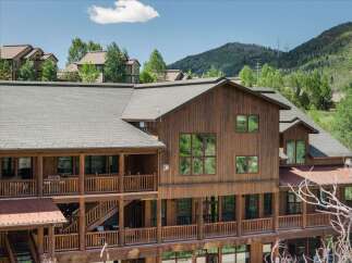 Experience rustic charm and mountain living in this stunning wooden lodge-style home.