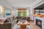 Experience cozy living in this inviting living room, featuring a plush sectional sofa perfect for relaxation.