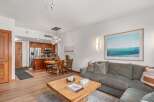 Experience modern living in this beautifully appointed condo, featuring an open-concept living and dining area perfect for entertaining.