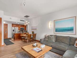 Experience modern living in this beautifully appointed condo, featuring an open-concept living and dining area perfect for entertaining.