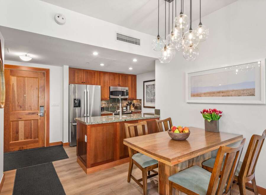 Experience modern living in this beautifully appointed condo featuring a sleek kitchen with stainless steel appliances and granite countertops.