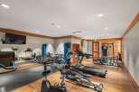 This well-equipped gym features a variety of cardio machines including treadmills and ellipticals, perfect for residents to maintain their fitness routines.