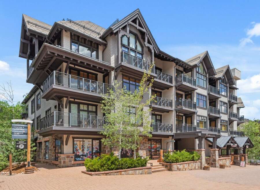 Experience luxury mountain living in this stunning multi-story residence, featuring multiple private balconies perfect for enjoying the crisp mountain air.
