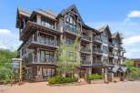 Experience luxury mountain living in this stunning multi-story residence, featuring multiple private balconies perfect for enjoying the crisp mountain air.