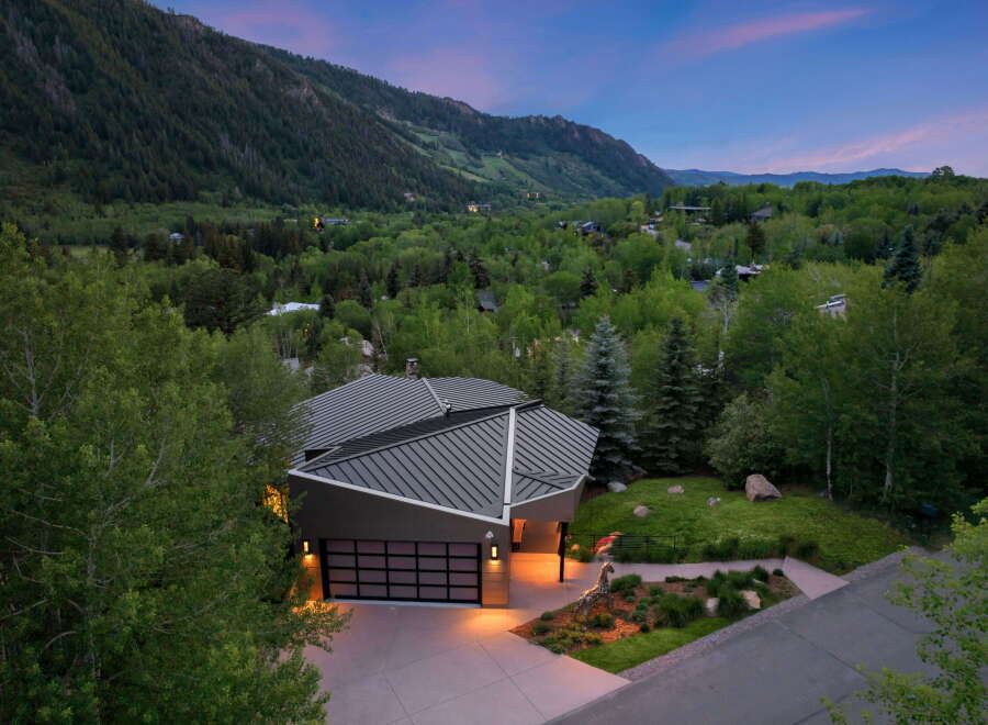 Experience modern luxury nestled in a serene mountain landscape with this stunning architectural home.