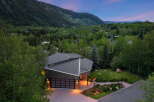 Experience modern luxury nestled in a serene mountain landscape with this stunning architectural home.