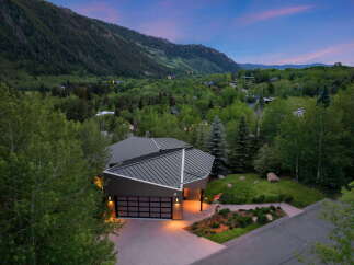 Experience modern luxury nestled in a serene mountain landscape with this stunning architectural home.