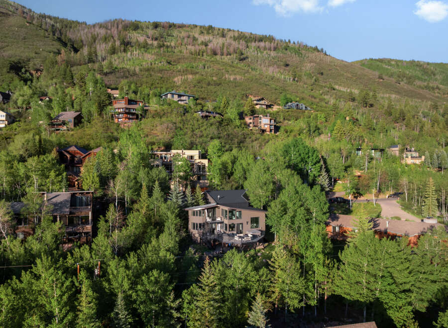 Nestled amidst lush greenery and rolling hills, this stunning mountain home offers breathtaking views and a serene escape.