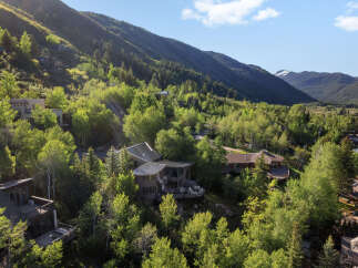 Nestled amidst lush greenery and rolling hills, this stunning mountain property offers a serene escape with breathtaking views.