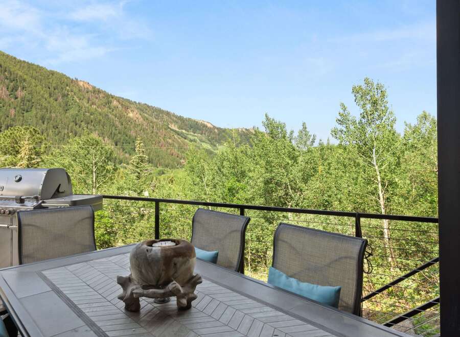 Enjoy breathtaking mountain views from this stunning deck, perfect for outdoor dining and entertaining.
