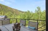 Enjoy breathtaking mountain views from this stunning deck, perfect for outdoor dining and entertaining.