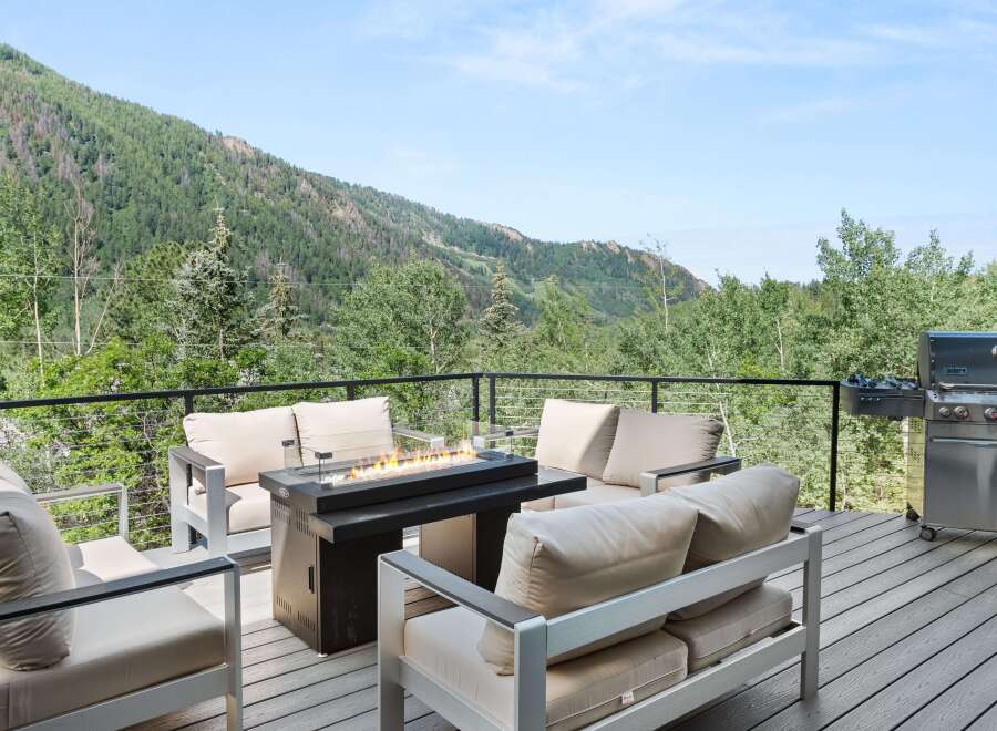 Experience breathtaking mountain views from this stunning deck, perfect for outdoor entertaining.